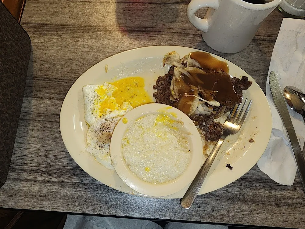 Grits Eggs Biscuits and Hamburger Steak with Gravey and Onions